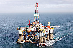 The Ocean Guardian, a semi-submersible oil drilling rig, under tow in British coastal waters