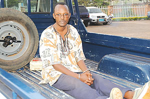 Deo Mushayidi in the back of a  Police Pick-up as he left prosecution headquarters in Kimihurura yesterday. (Photo/ J. Mbanda)