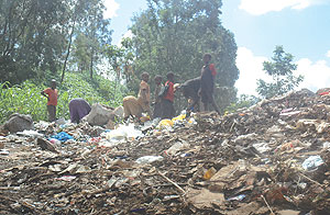 TO BE PHASED OUT: Children going through the garbage heap at Nyanza Landfill