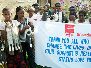 Beneficiaries pose for a group photo after receiving the rabbits. (Courtesy photo)