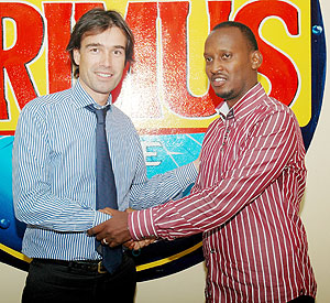 DEAL MAKERS: Bralirwau2019s Commercial Director Alexander Koch (L) and Ferwafau2019s CEO Jules Kalisa shake hands after annoucing the partnership yesterday at Bralirwa head offices, Kicukiro. (Photo: F. Goodman)