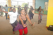 Hard at work: Urukerereza members practicing at Amahoro Studium.