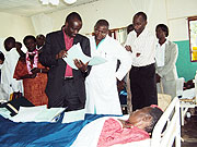 Minister of Health Dr. Richard Sezibera speaks to one of the patients at Kibogora hospital. (Courtesy photo)