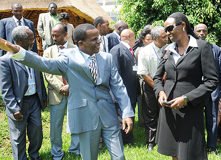 Agriculture Minister, Agnes Kalibata (R), and UNECA Sub Region Office Director, Antonio Pedro, chat during a meeting on food security on Monday. (Photo J Mbanda)..