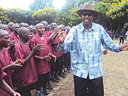 Minister of Youth, Protais Mitali sings along with the youth. (photo/ R. Mukombozi)