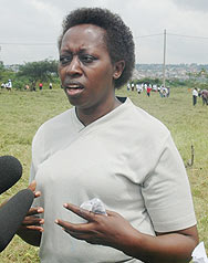 Kigali City Mayor, Dr.Aisa Kirabo speaking to the media after the Umuganda yesterday. In the background are some of the participants (Photo/ F. Goodman )