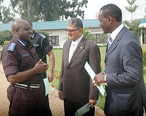 Commissioner General of Police, Emmanuel Gasana, talks to UTEXRWA Boss, Raj Rajendran (C) and the Chairman of the Private Sector Federation Robert Bayigamba yesterday(J Mbanda