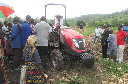 The Minister of Agriculture and Animal Resources,Dr. Agnes Kalibata driving one of the tractors. (Photo; I. Niyonshuti)
