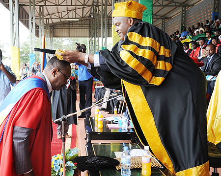 Dr Hamadoun Toure being awarded an Honorary degree by Dr Charles Muligande. (Photo J Mbanda)