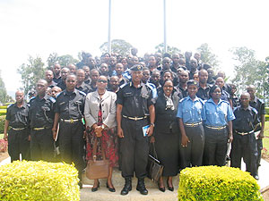Assistant Commissioner of Police Emmanuel Butera and Rose Rwabuhihi in a group photo with the trained officers.  (Courtesy Photo)