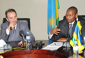 The Minister of Finance John Rwangombwa (R) and the French Ambassador to Rwanda   Laurent Contini.  (Photo; J. Mbanda)