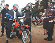 TEST RIDE: Minister Stanslas  Kamanzi tests one of the bikes. (Photo/ J. Mbanda)