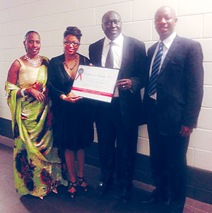 Minister of Justice, Tharcisse Karugarama (2nd from right) holding the Diversity award. Eith him are Second Counsellor Enid Mbabazi, u2018Unity is the Strengthu2019 representative Nadya van Pottens, the Chargu00e9 du2019Affaires a.i, Parfait Gahamanyi.