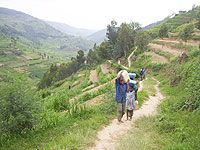Rural children travel long journeys to fetch water. Photo by A.Gahene