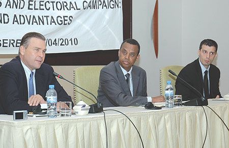 Ambassador, Stuart Symington speaks at the opening as  Anicet Kayigema and Gaston Ain look on.  ( Photo/ F. Goodman )