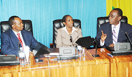 Prime Minister Bernard Makuza (R) talks to Ministers Agnes Kalibata (C) and Vincent Karega in Parliament on Tuersday (Photo J Mbanda)