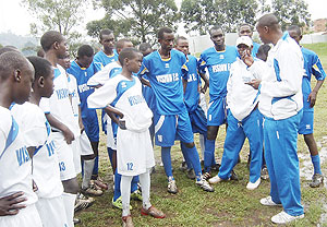 Vision Football Academy Head Coach Kassim Rugamba (R) giving tips to his team during a training session at Lugogo, Kampala, Uganda. (Courtesy photo)