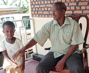 Yohane Bizimana with his daughter (Photo / F.  Goodman )