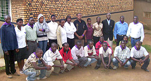 Genocide orphans pose in a group photograph with Taxi motorcyclists and Mgr. Ruzindana at their Byumba orphanage. (Photo: A. Gahene)