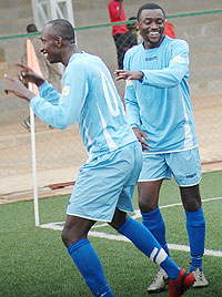 Yusuf Ndayishimiye celebrates with a teammate after scoring for Rayon in the Primus National League. The Amavubi Stars striker opened Rayonu2019s scoring against Marines yesterday. (File photo)