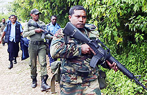 East Timorese soldiers and police patrol as part of an operation to capture rebels involved in attacks on the president and prime minister in March 2008