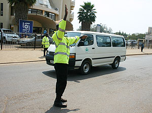 A Traffic Police officer directing traffic. Road safety is paramount.