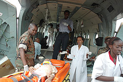 Members of the RDF helping evacuate victims of an earthquake