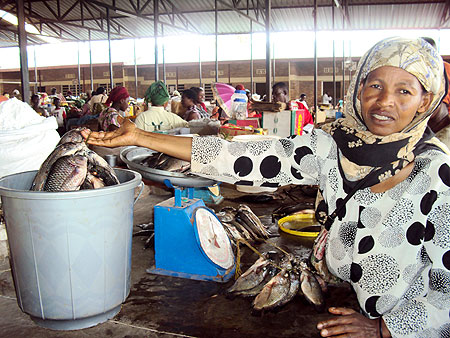 Residents buying fish at the market. (Photo / S. Rwembeho)