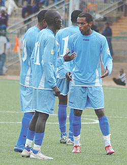 Rayon players share ideas during a Primus league encounter with Atraco. The Blues are desperate to reach the knock out stage of the Kagame Cup. (File Photo)