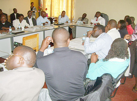Governor Bosenibamwe together with district leaders during a meeting to evaluate development activities in the province. (Photo: A. Gahene)
