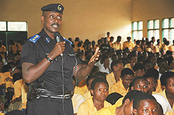 Chief Supt. Rogers Rutikanga addressing students of APAPE Secondary School yesterday (Photo; F. Goodman).