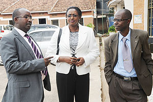 The Director General of Labour, Anna Mugabo(C) with CESTRARu2019s African Biraboneye and Jeremy Nsengiyumva after the meeting . (Photo: J. Mbanda)