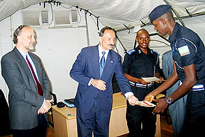 USAIDu2019s Rick Dannielle handing over certificate to one of the officers who completed the course (Courtesy Photo)
