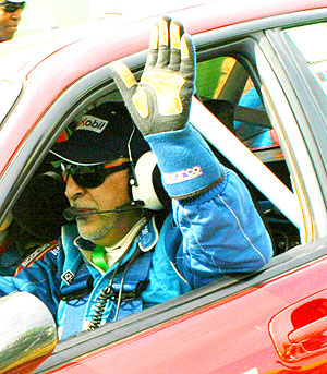 Fitidis salutes the crowd during last yearu2019s KCB Mountain Gorilla rally. (File Photo)