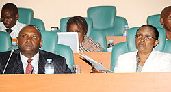 Senators Faustin Munyakabera (L) and Agnes Kayijire during the presentation of the report yesterday. (Photo; J Mbanda)
