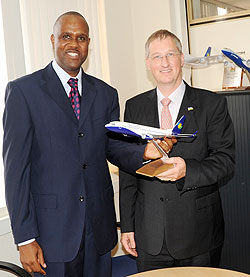 The outgoing CEO of RwandAir John Mirenge (L) and the new company CEO Rene Janata yesterday (Photo; J. Mbanda)