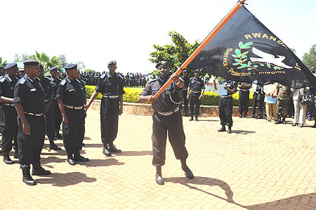 Commissioner General of Police Emmanuel Gasana flagging off the National Police 10th anniversary celebrations.