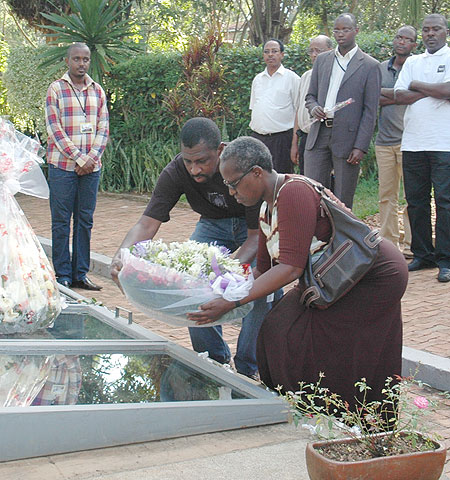 Action Aid International Director for Africa region, Williams Tennyson (L) and Country Director Josephine Uwamaliya laying a wreath at Gisozi Genocide Memorial yesterday (Photo: F. Goodman)