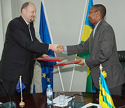 The Minister of Finance John Rwangombwa shaking hands with Amb. Michel Arrion after the signing of the agreement yesterday. (Photo; F. Goodman)