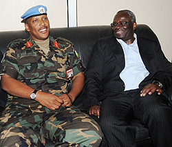 Prof.Ibrahim Gambari ( R) and Lt.Gen. Patrick Nyamvumba chat at Kigali International Airport recently. (File photo)