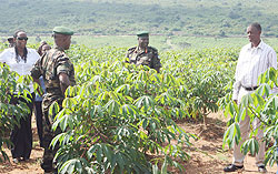The Minister of Defence, Gen. James Kabarebe (R) during the tour of 600 hectare cassava plantation in Mayange Sector, Bugesera District.  (Courtesy photo)