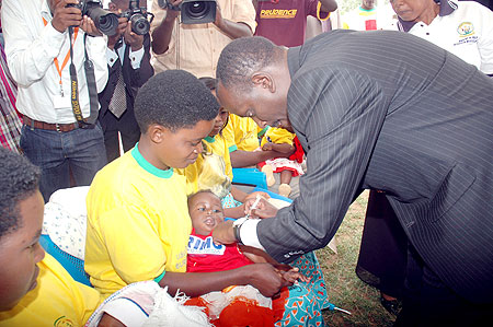Health Minister Dr. Richard Sezibera taking part in the Immunisation exercise in Bugesera District recently.(File photo)