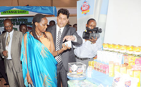 The Minister of Agriculture Dr. Agnes Kalibata takes a look at some of the Dairy Products on display at the Diary Exhibition yesterday. (Photo J. Mbanda)