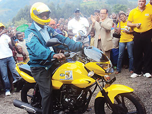 Bigirimana Ismael tests his newly acquired motorcycle. PhotoB Mukombozi