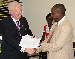 International Property Foundation CEO (L) Norman Flynn and the Chairman Steering Committee of REAR Charles Haba after the signing. (Photo J Mbanda)