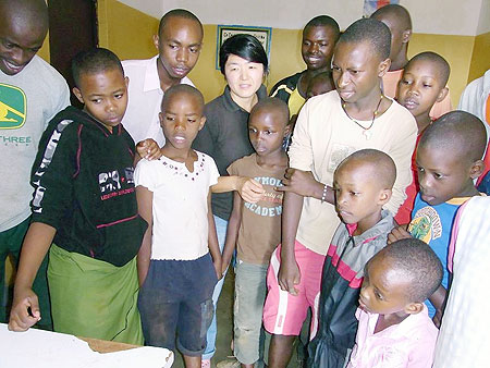 Ms Kayoko Higika (centre) with some of the children at Gisimba Memorial Centre. (Photo: G. Mugoya)