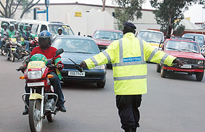 Hard at work. A Rwanda Traffic Policeman