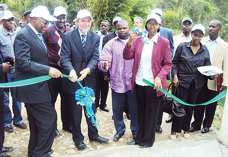 State Minister in charge of Energy and Water Eng. Colette Ruhamya cuts the ribbon commission the plant in the company of Dutch Ambassador.