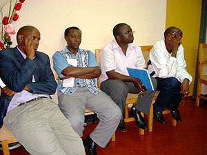 Eric Nikize (Second from right holding book) during a recent district employees meeting. (File photo)