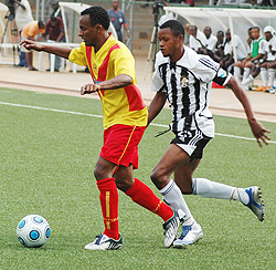 Adane Girma protects the ball from APR skipper Patrick Mafisango during a friendly early this year.  (File Photo)